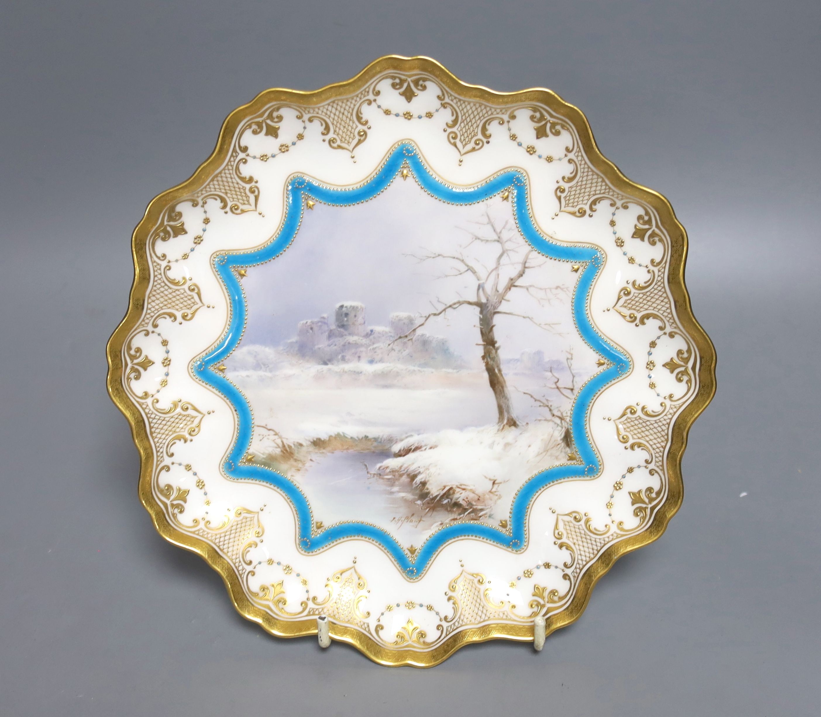 A Royal Doulton cabinet plate, painted with a river landscape, with Caerphilly Castle, signed, 22.5cm